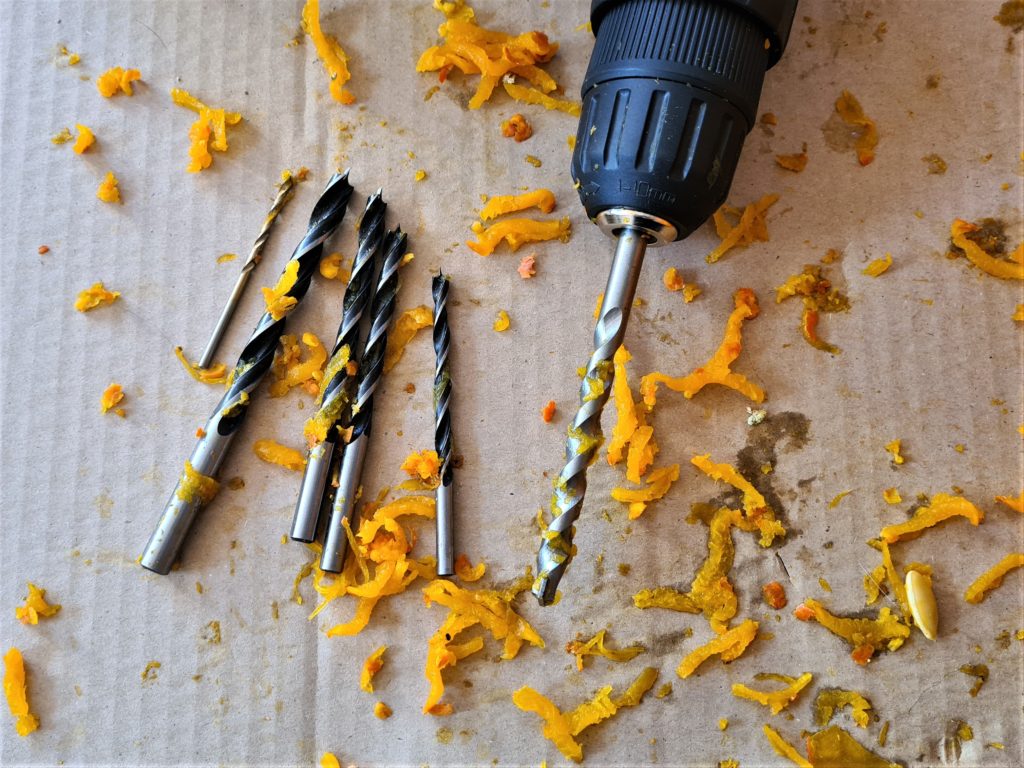 Use drill bits of different sizes to make a pumpkin lantern
