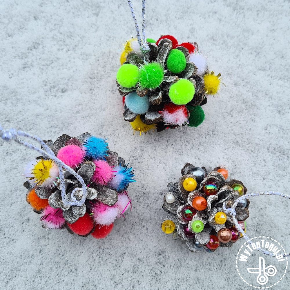 Pine cones with beads and pom poms