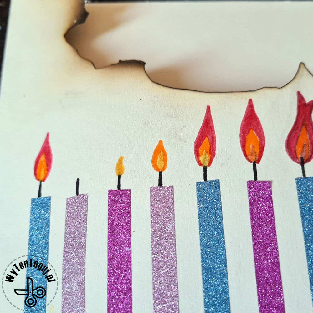 Sticking candles out of washi tape and drawing flames