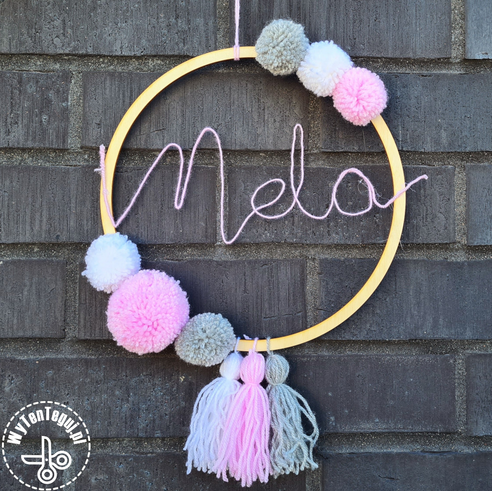 Name ring with pom poms and tassels