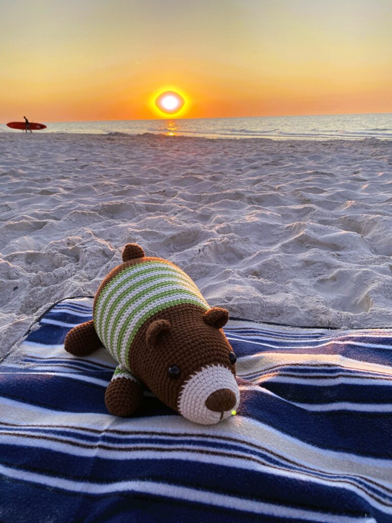 Lazy teddy bear in a seaside