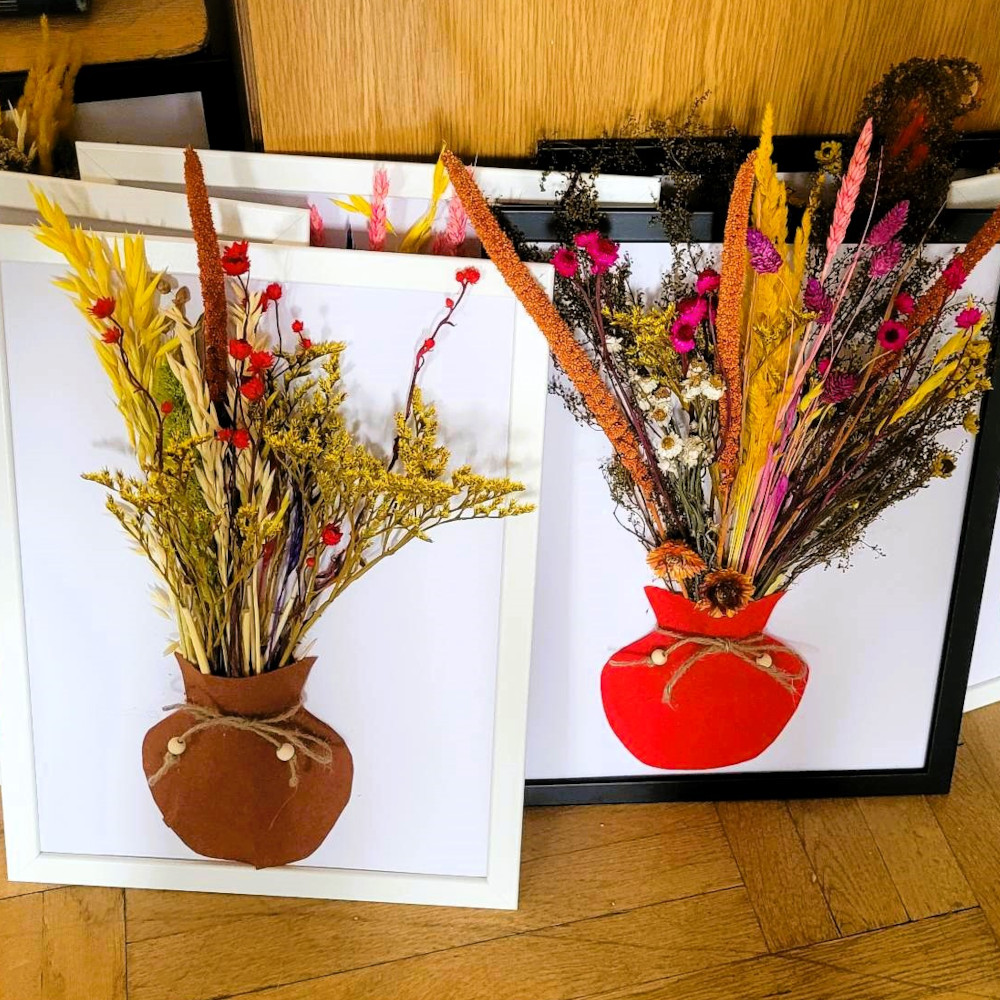 Felt vase with dried flowers in a frame