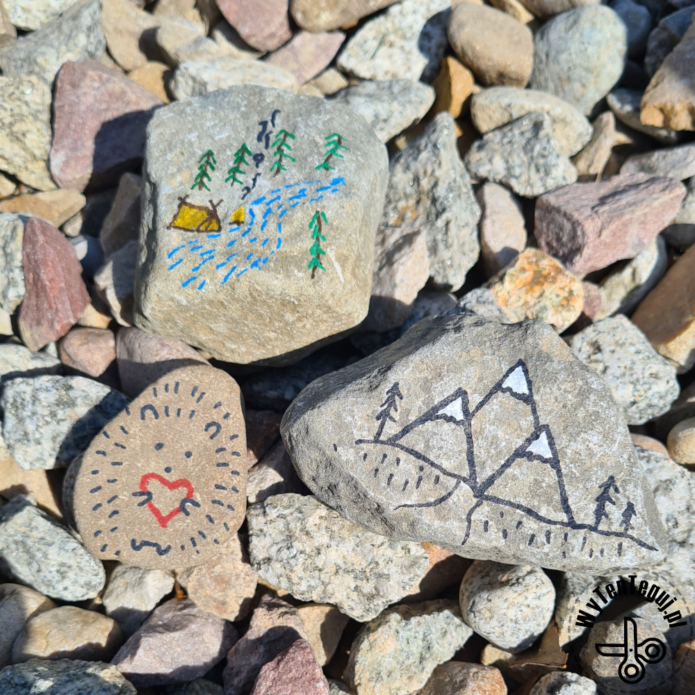 Painting rocks on a mountain trail